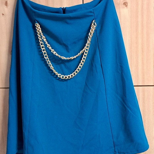 Skirt in cypress color with chain accessory, size 34, new