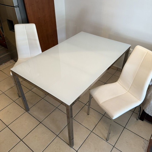 Glass dining table and chair set used, metal frame, white chairs