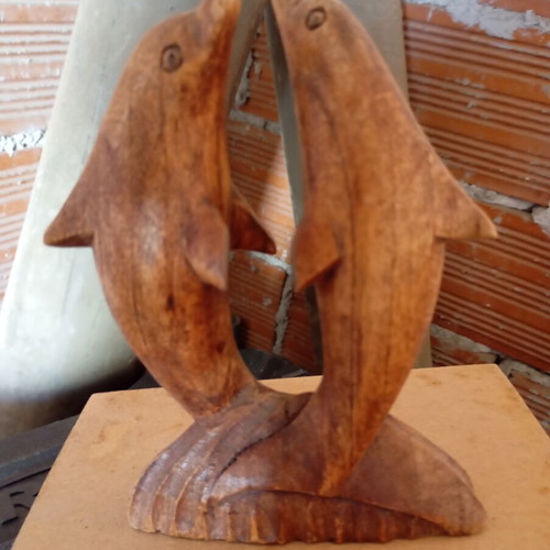 Handcrafted wooden sculpture of two dolphins, unique piece