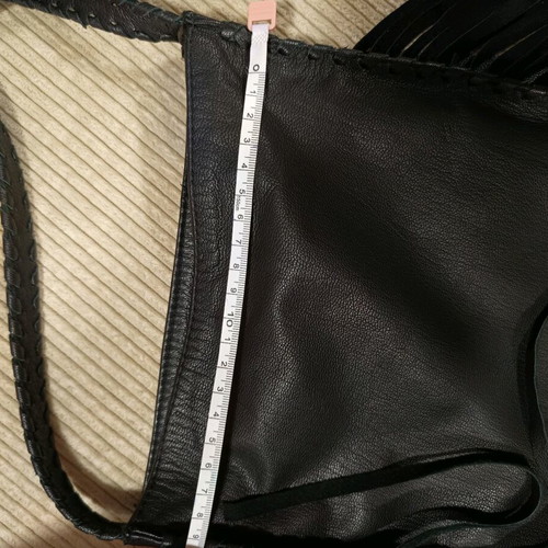 Women's leather crossbody bag with fringes nearly unused black