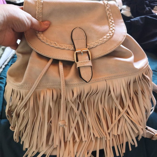 Backpack like new beige with fringe