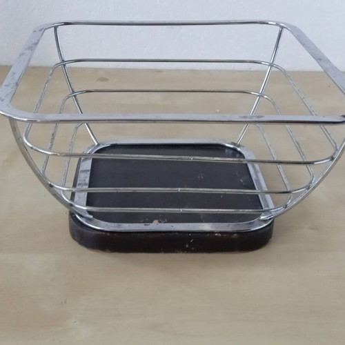 Metal fruit bowl with wooden base used