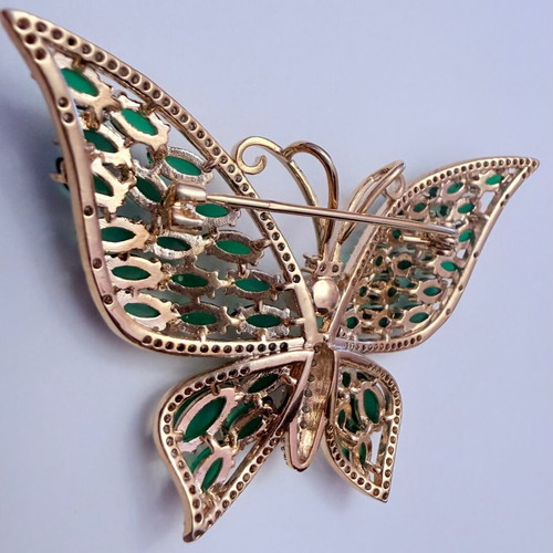 Vintage butterfly brooch with green cabochon stones and white zircon, like new