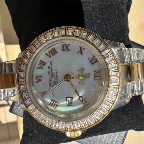 Watch with iridescent crystals like new, zircon and gold