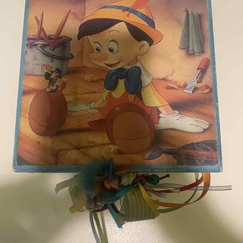 Wooden box with Pinocchio figure used