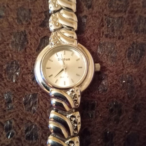 Women's elegant silver watch like new with bracelet and white stones