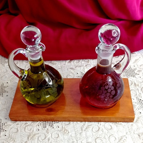 Handmade oil and vinegar set with carved glass bottles and wooden base