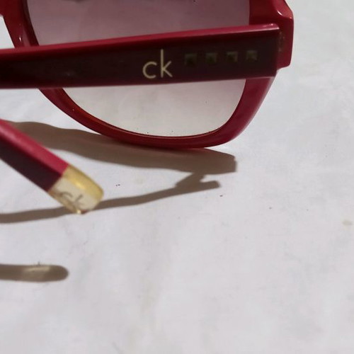 Calvin Klein sunglasses used, red frame with brown gradient lenses