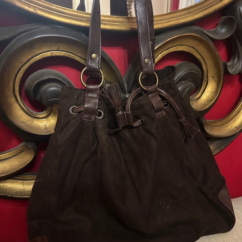 Brown suede shoulder bag used with woven details and drawstring