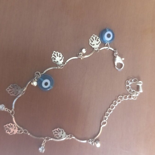 Anklet in gold color with two blue eye rhinestones