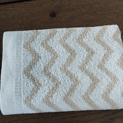 Laura Ashley face towel like new with geometric pattern light blue beige
