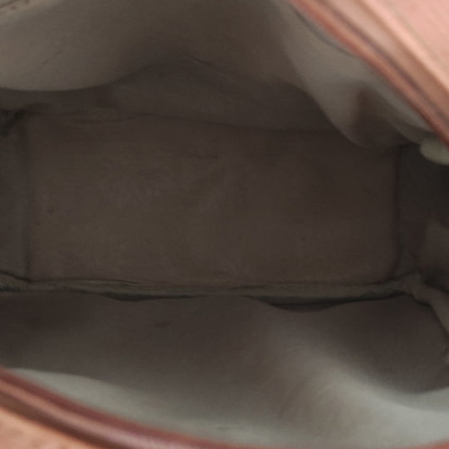 Back pack tan used with internal and external pockets