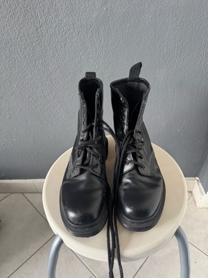 Dr. Martens black ankle boots used with black stitching