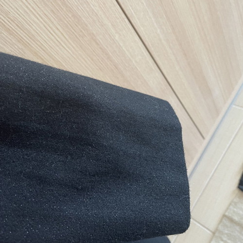 Black coat used with wool by Carling
