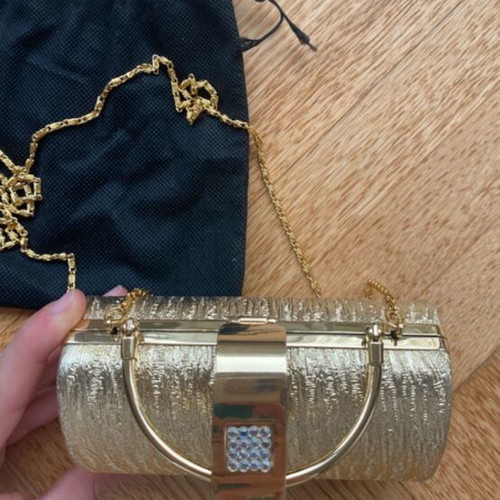 Gold clutch bag with chain strap