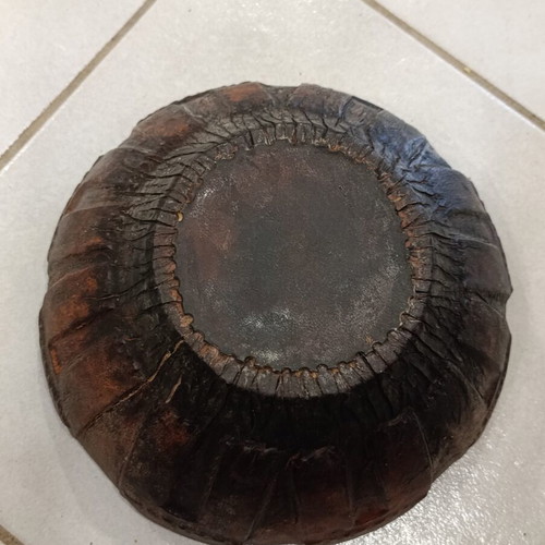 Antique wooden bowl with leather used
