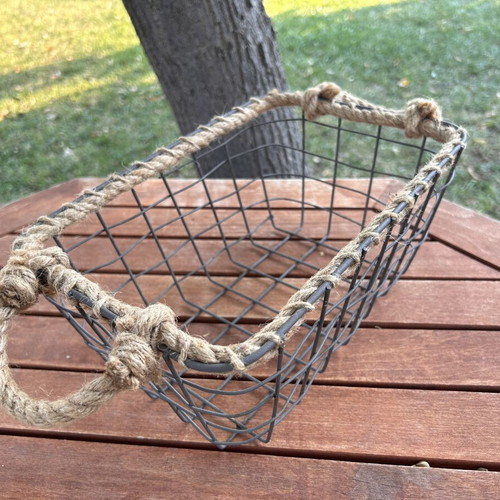 Boho style decorative basket with natural rope handles
