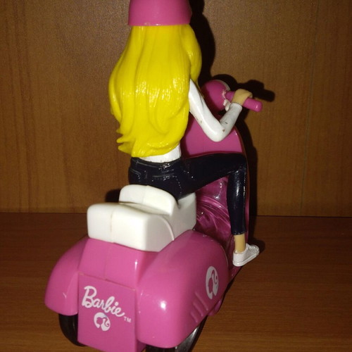 Barbie figure on motorcycle used with motion
