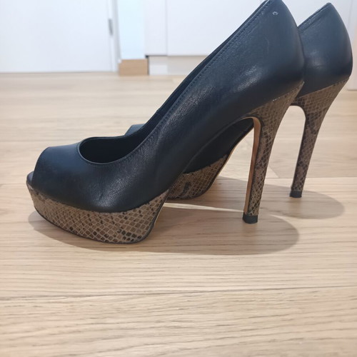 Peep toe heels used, leather with animal print platform