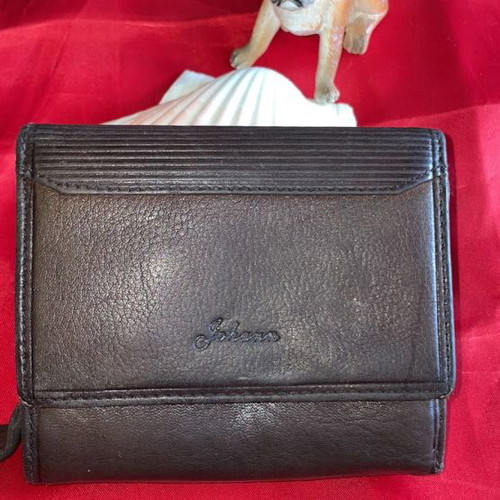 Brown leather wallet used with multiple compartments