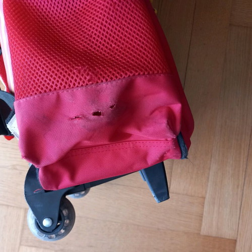 School trolley bag used with tear on side pocket