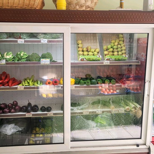 Refrigerated display case for produce used with new motor