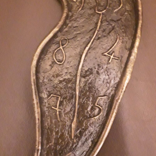 Dali wall sculpture bronze, like new, exact replica
