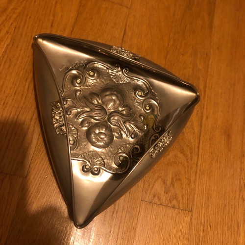 Decorative triangular vessel used with embossed flowers