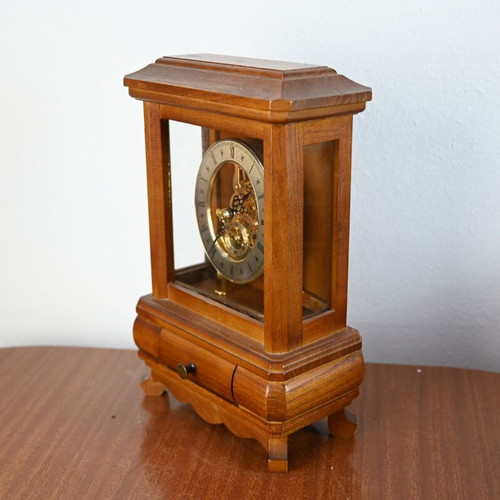 Wooden table clock used with visible skeleton mechanism and drawer