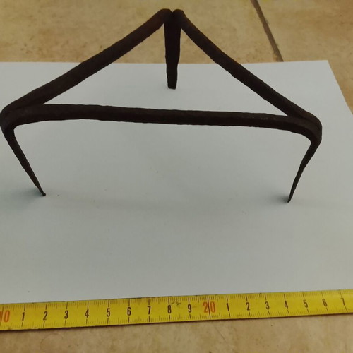 Wrought iron old fireplace trivet used
