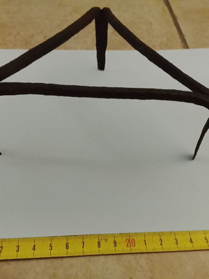 Wrought iron old fireplace trivet used