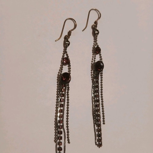 Dangling earrings with purple stones used