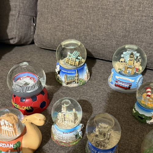 Tourist souvenir snow globes new from various world and Greek locations
