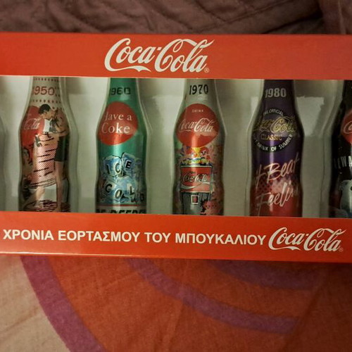 Coca Cola 100 Years aluminum collectible bottles new, miniatures