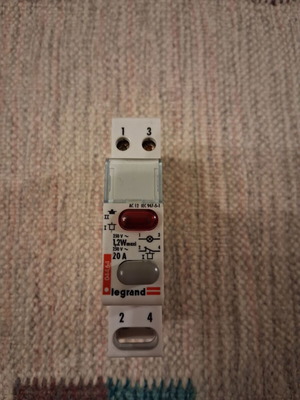 Legrand rail-mounted button switch with indicator light