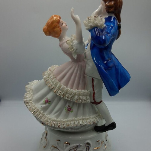 Vintage porcelain music figurine of dancing couple, like new