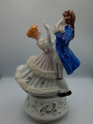 Vintage porcelain music figurine of dancing couple, like new