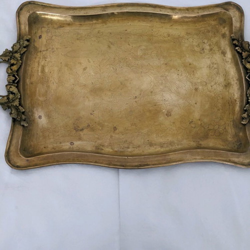 Vintage brass serving tray used with carved handles
