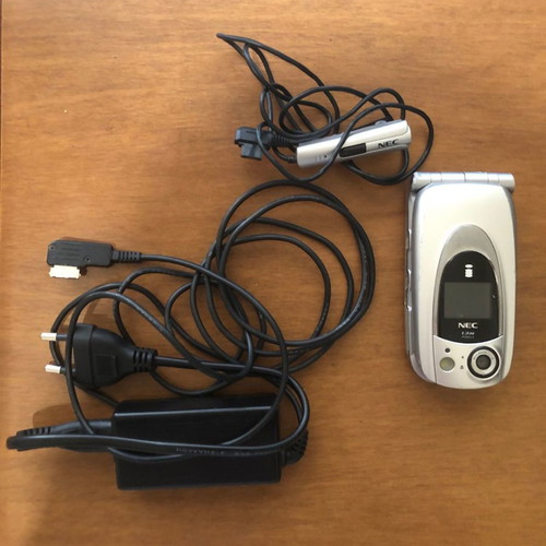 NEC 410i mobile phone used with charger and handsfree