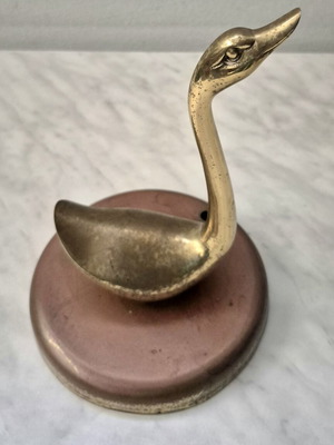 Decorative brass duck on iron base used