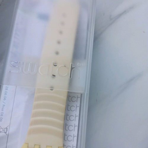 Swatch unisex watch with new yellow silicone strap, like new