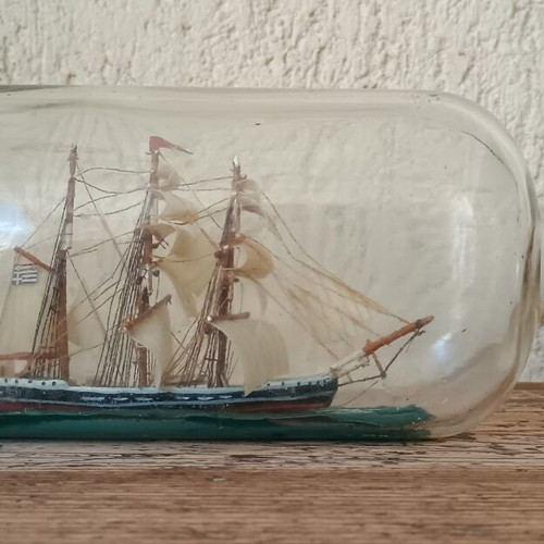 Vintage decorative ship in glass bottle used