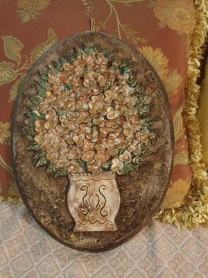 Handmade wall decoration with decoupage and clay flowers