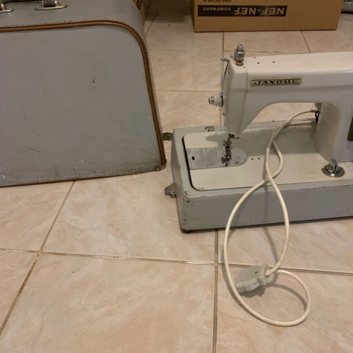 Electric collectible sewing machine used with carrying case