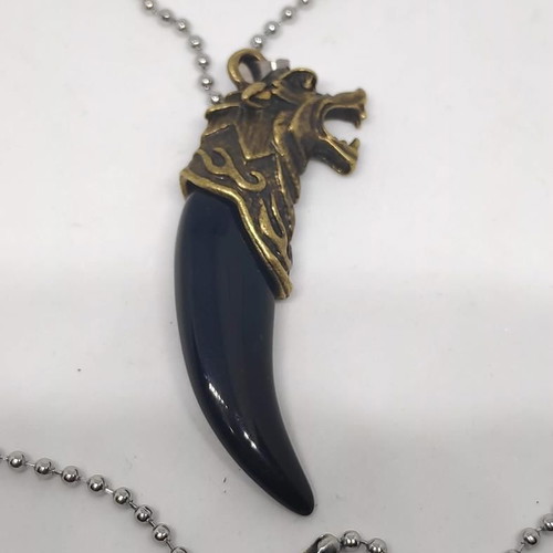 Necklace with wolf tooth pendant like new, gold and black