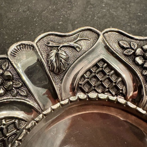 Vintage bowl with silver lining and engraved design, used