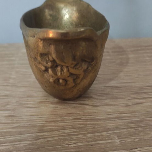 Vintage brass miniature vessel with embossed design