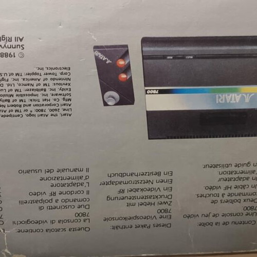 Atari 7800 console used with 2 joysticks and games