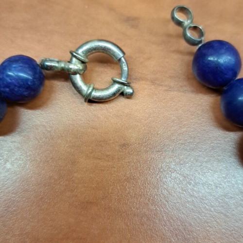 Necklace with blue semi-precious stones and silver setting like new
