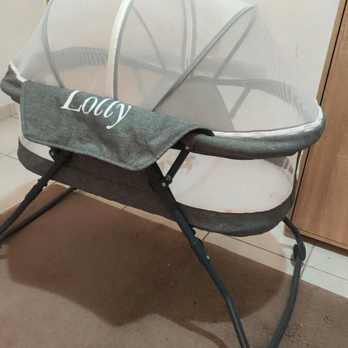 Cangaroo Lolly baby cot used with mattress and mosquito net